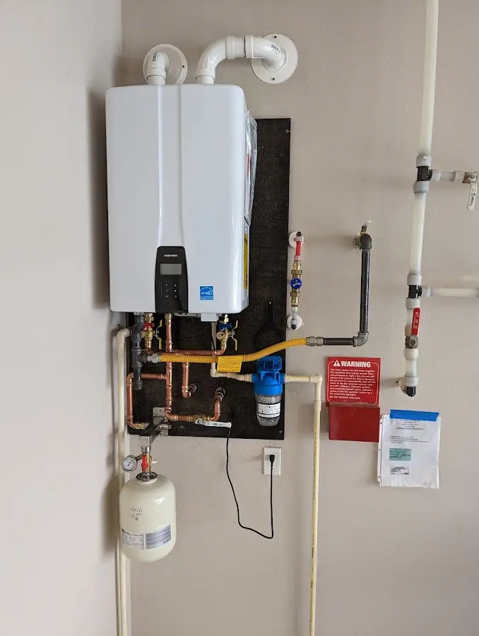 Professional plumber installing copper piping in a Abingdon home